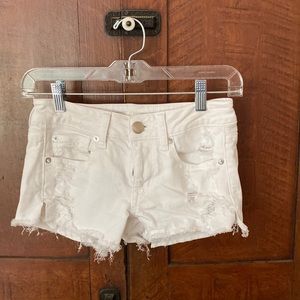 White distressed jean shorts